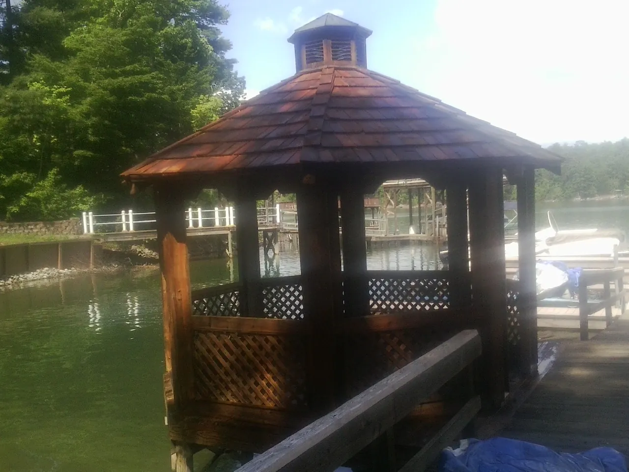 Cedar shake gazebo roof rebuilt on a lake dock in Gowen