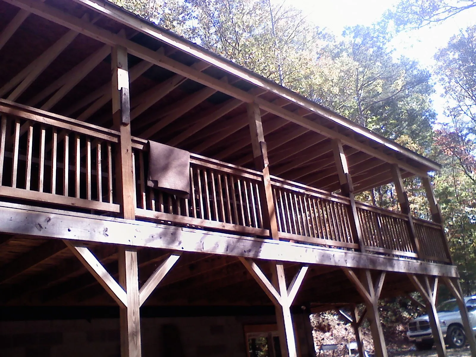 Timber framing under a new elevated porch and deck — Roof Leak Repair in Gowen by Roofing Brothers